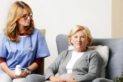 home health care staff and the senior woman sitting