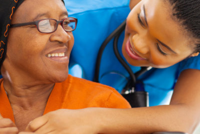 healthcare staff checking the health of the senior woman patient