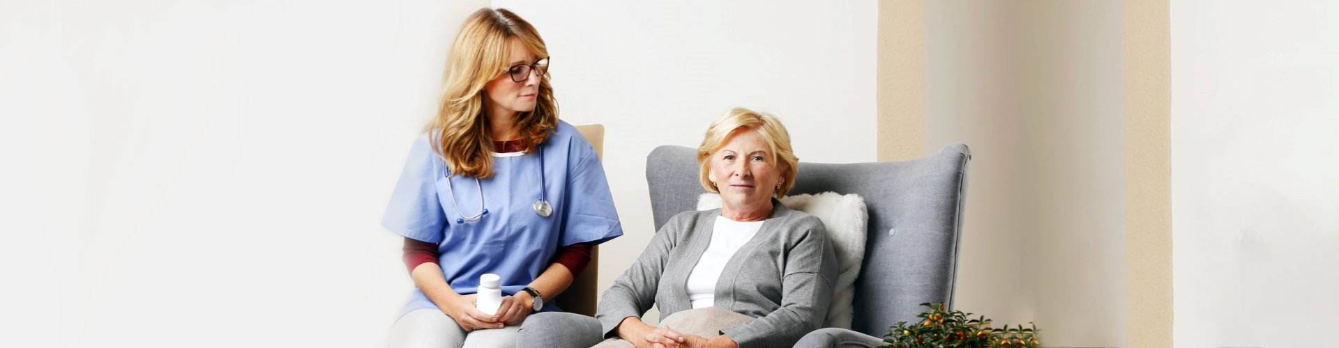 home health care staff and the senior woman sitting