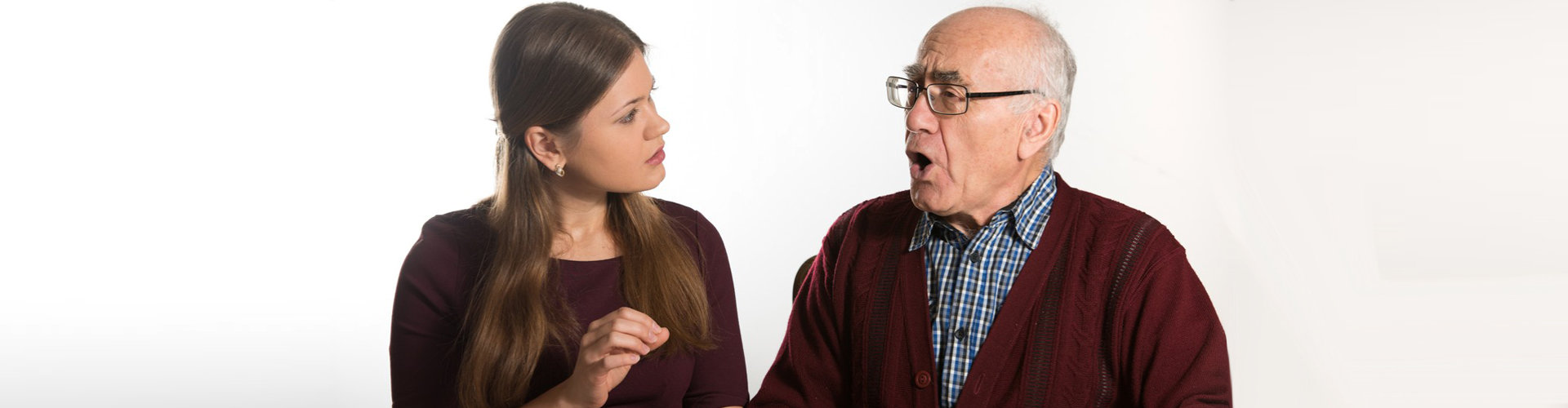 healthcare staff helping senior man to talk clearly