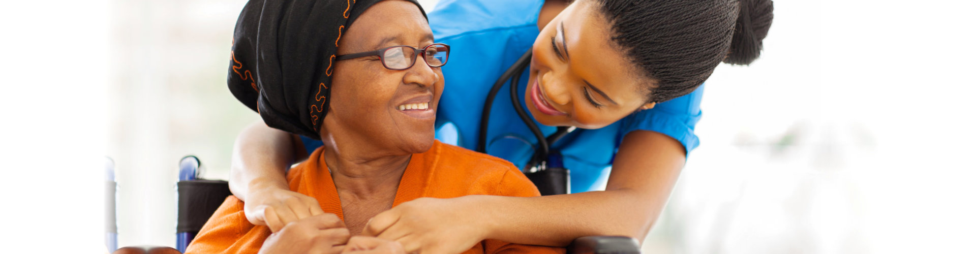 healthcare staff checking senior woman's health