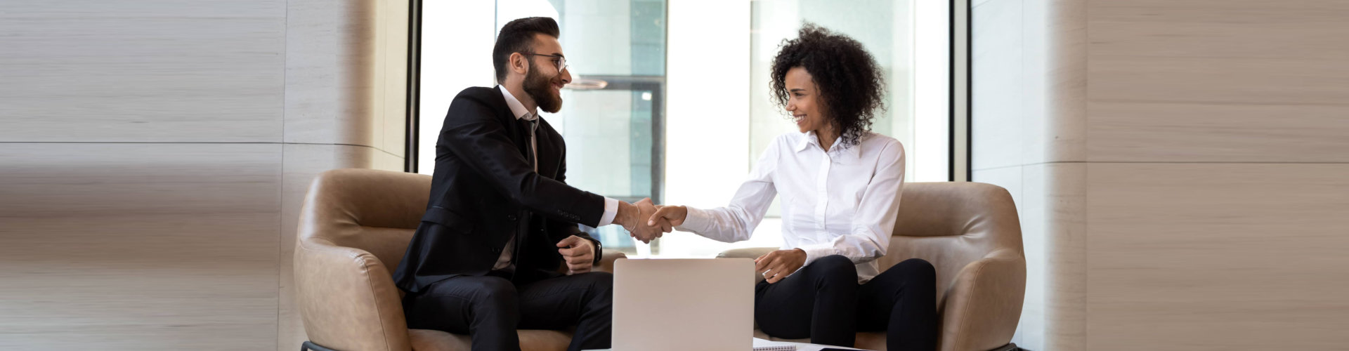 image of two people shaking hands