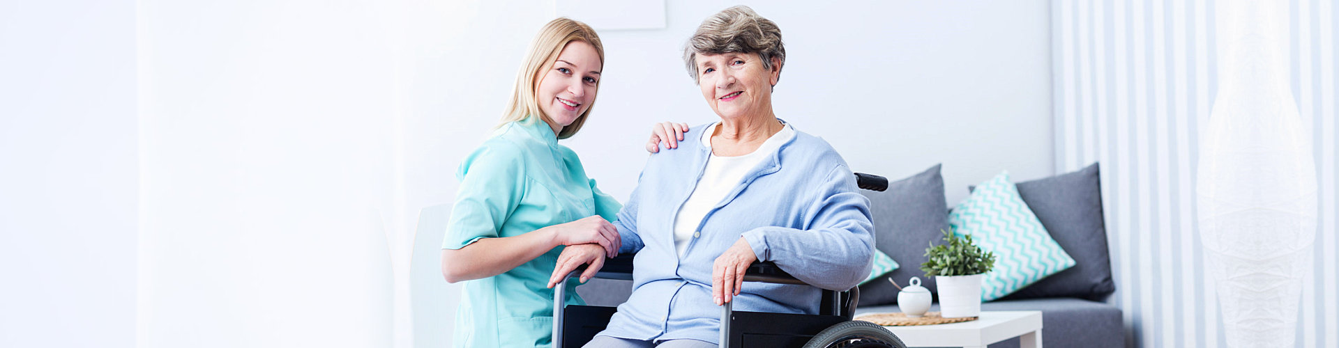 image of a female caregiver with an elderly woman sitting